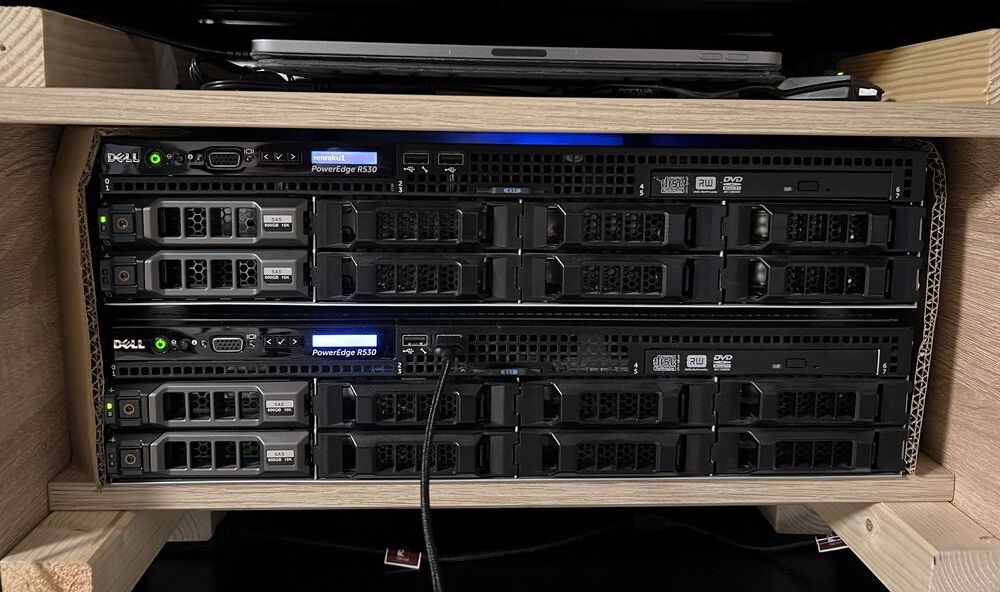 Two Dell R530 servers stacked inside a wooden box