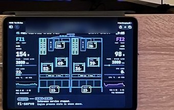 Close-up of the iPad showing power, fan speed and temperatures for both servers