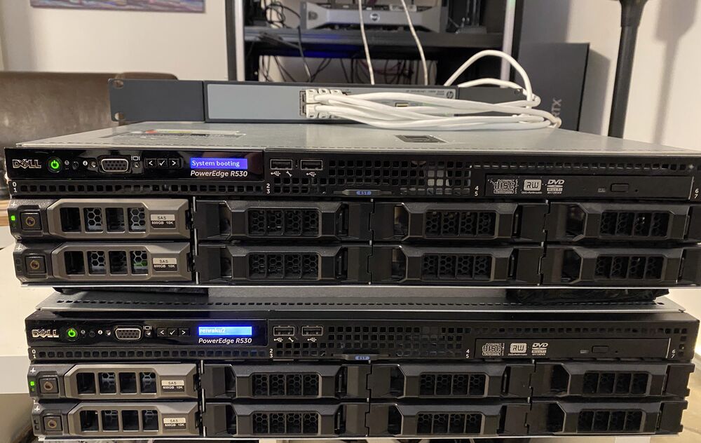 Two Dell R530 servers stacked on a desk, front view